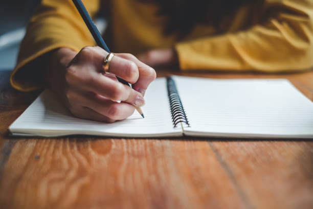 Close Up Woman Hand Writing On Notebook Stock Photo - Download Image Now -  Writing - Activity, Handwriting, Note Pad - iStock